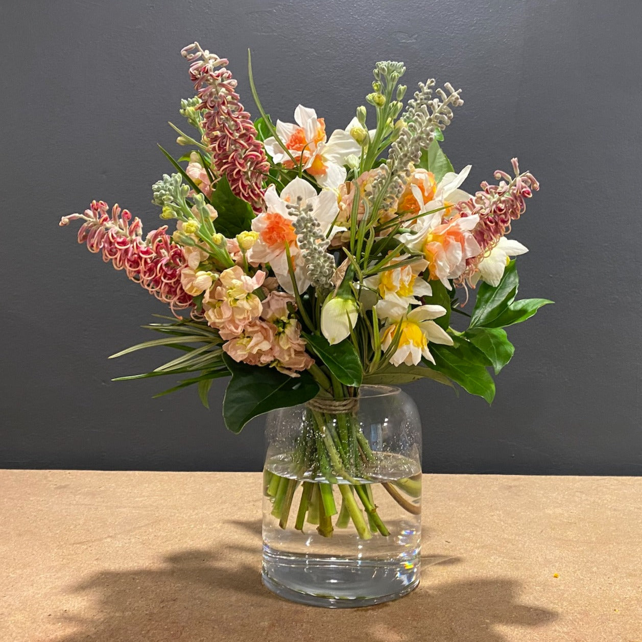 Delicious two toned daffodils are mixed with stock and an Australian native.