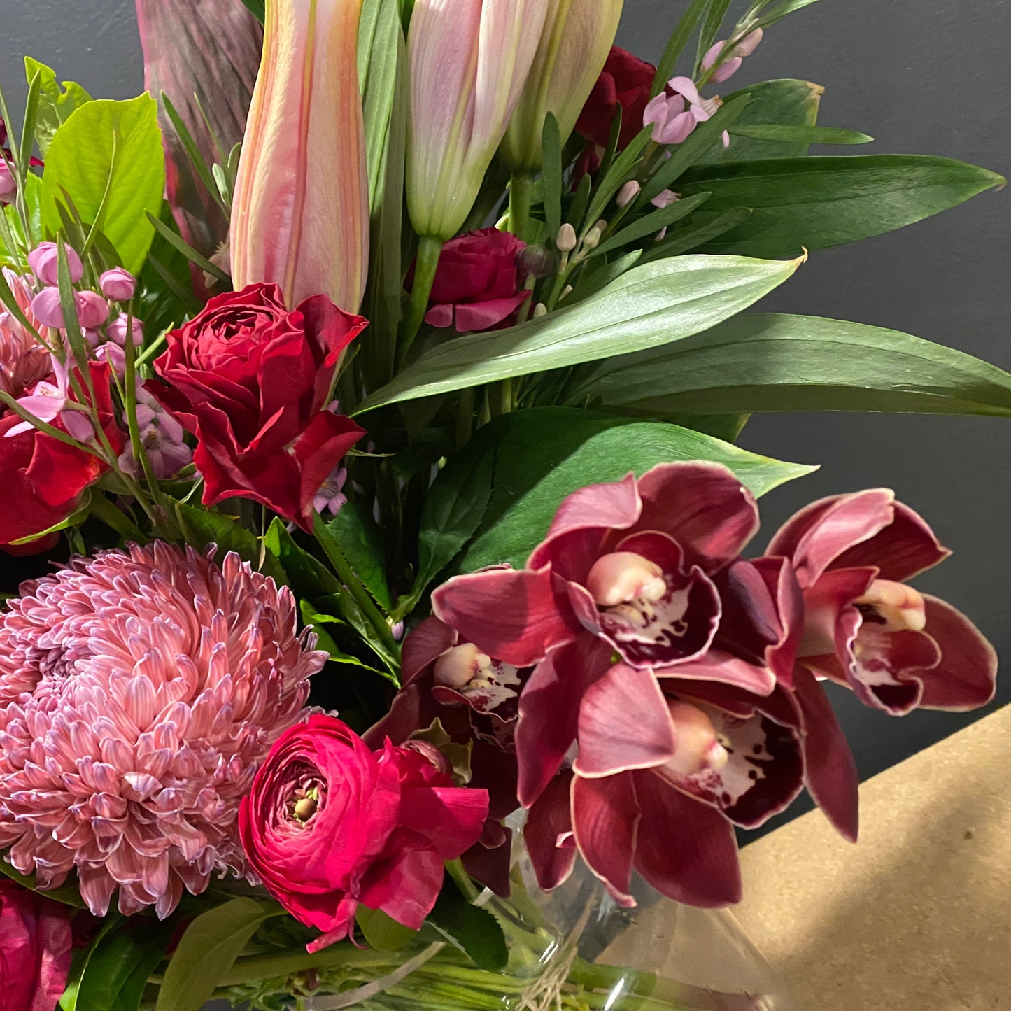 Orchids, lilies, ranunculi and chrysanthemum.